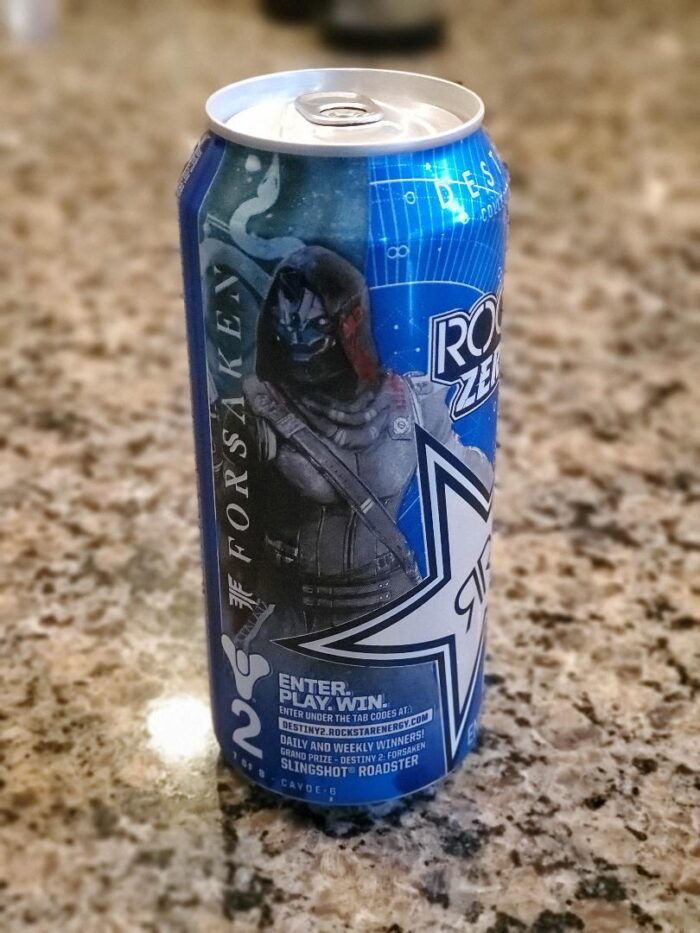 A can of rockstar energy drink on the counter.